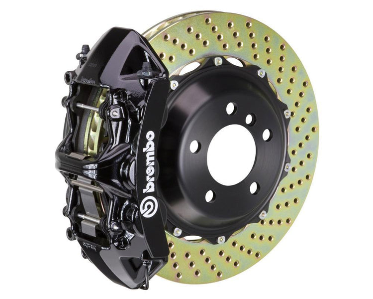 A front view of Brembo GT Front Big Brake Kit 380x32 2-Piece 6-Piston Drilled Rotors for Honda Civic Type-R (FL5) in black caliper with white background