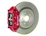 A front view of Brembo GT-S Front Big Brake Kit 323x28 1-Piece 4-Piston Drilled Rotors for Porsche 911S / SC / Carrera 1966-1989 with red caliper