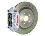 A front view of Brembo GT-S Front Big Brake Kit 323x28 1-Piece 4-Piston Drilled Rotors for Porsche 911S / SC / Carrera 1966-1989 with white caliper