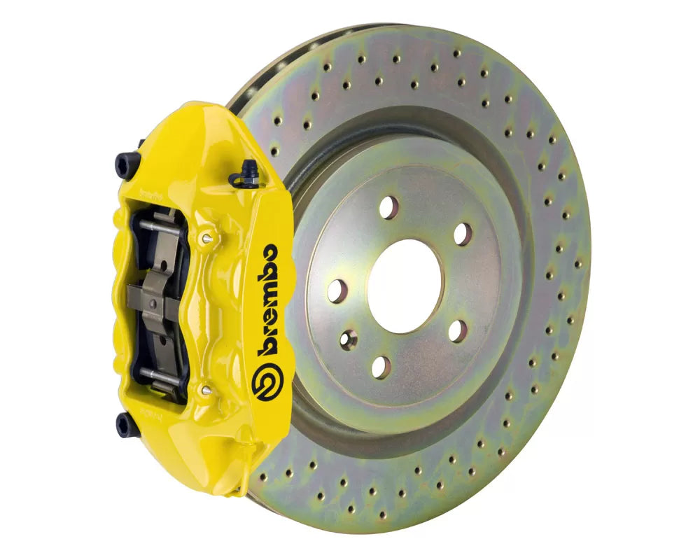 A front view of Brembo GT-S Front Big Brake Kit 323x28 1-Piece 4-Piston Drilled Rotors for Porsche 911S / SC / Carrera 1966-1989 with yellow caliper