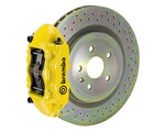 A front view of Brembo GT-S Front Big Brake Kit 323x28 1-Piece 4-Piston Drilled Rotors for Porsche 911S / SC / Carrera 1966-1989 with yellow caliper