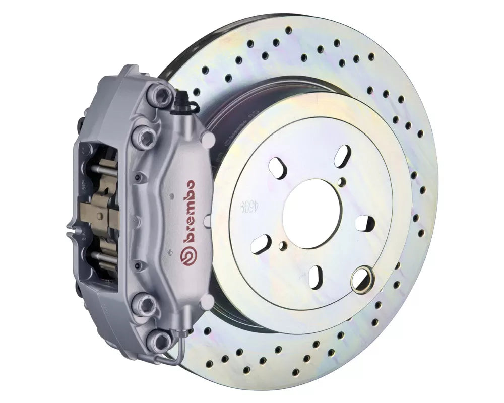 A front view of Brembo GT Rear Big Brake Kit 309x28 1-Piece 4-Piston Drilled Rotors for Porsche 911S / SC / Carrera 1966-1989 with silver caliper