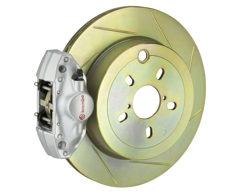 A front view of Brembo GT Rear Big Brake Kit 316x20 1-Piece 2-Piston Slotted Rotors for Subaru Impreza / WRX 2002-2007 with silver caliper with white background