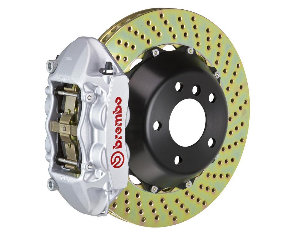 A front view of Brembo GT Rear Big Brake Kit 345x28 2-Piece 4-Piston Drilled Rotors for Porsche 993 C2 / C4 in silver caliper with white background