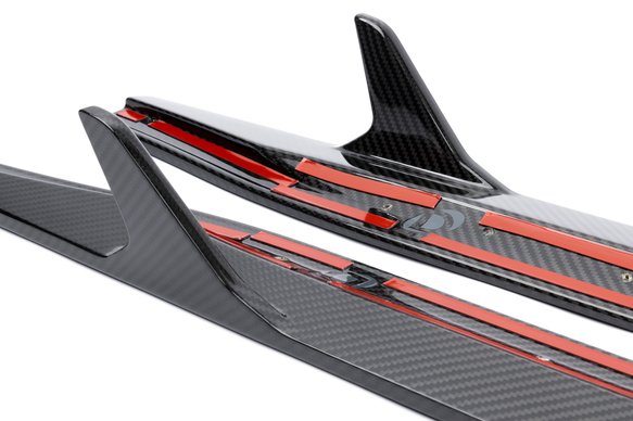 A close up view of DINAN SIDE SKIRTS BMW M3/M4 2021-2024 with white background