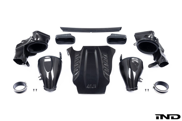 A front view of Eventuri Black Carbon Intake System For BMW F9X X5M / X6M / G09 XM with white background