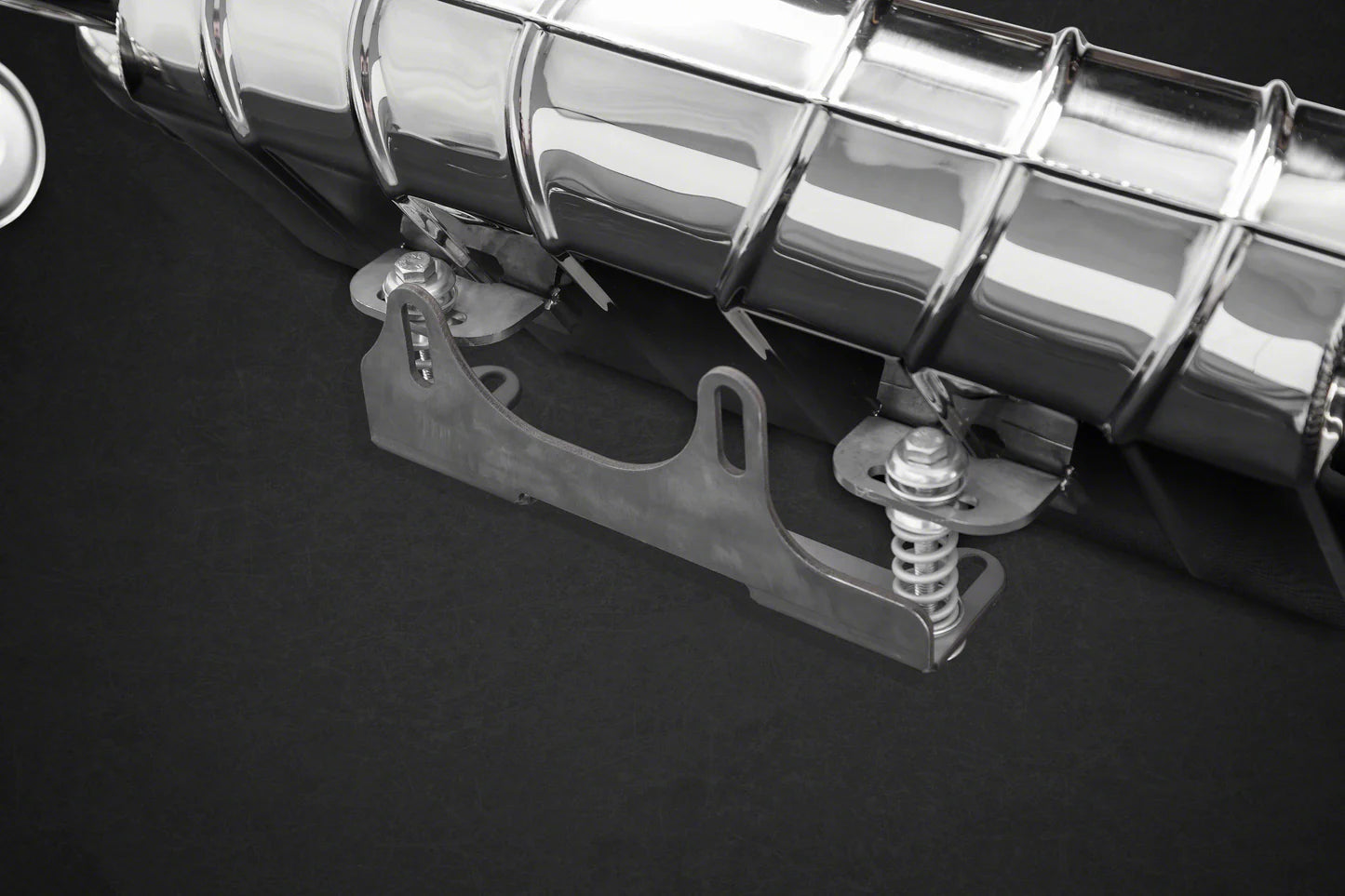closeup of Capristo muffler for Porsche 991.2 Carrera with black background