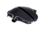 Black carbon fiber inlet plenum with curved chambers and cylindrical outlet pipe on white background - Eventuri inlet plenum for BMW E60 M5 E63 M6