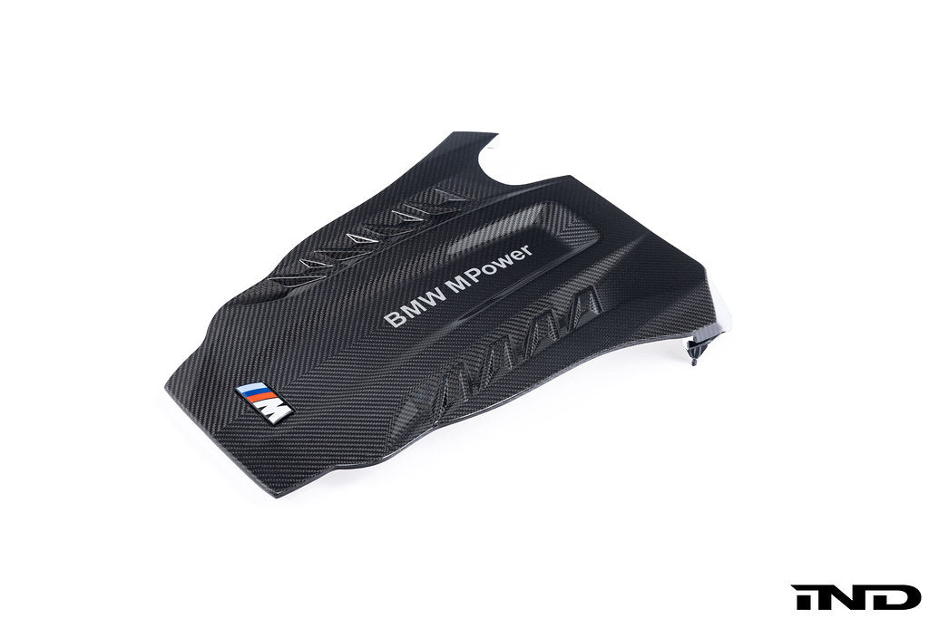A close up view of Eventuri Black Carbon Intake System For BMW F9X X5M / X6M / G09 XM with white background