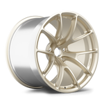 Single forged aluminum wheel with champagne gold face finish and polished silver barrel shown at three-quarter angle - APEX Wheels wheel for 20x11 ET45 PSCL - Motorsport Gold