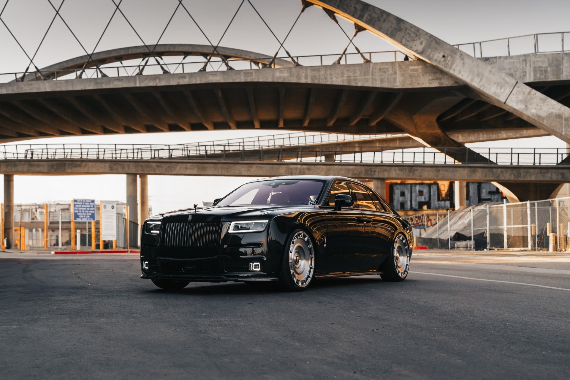 Urban Rolls-Royce Ghost under a bridge
