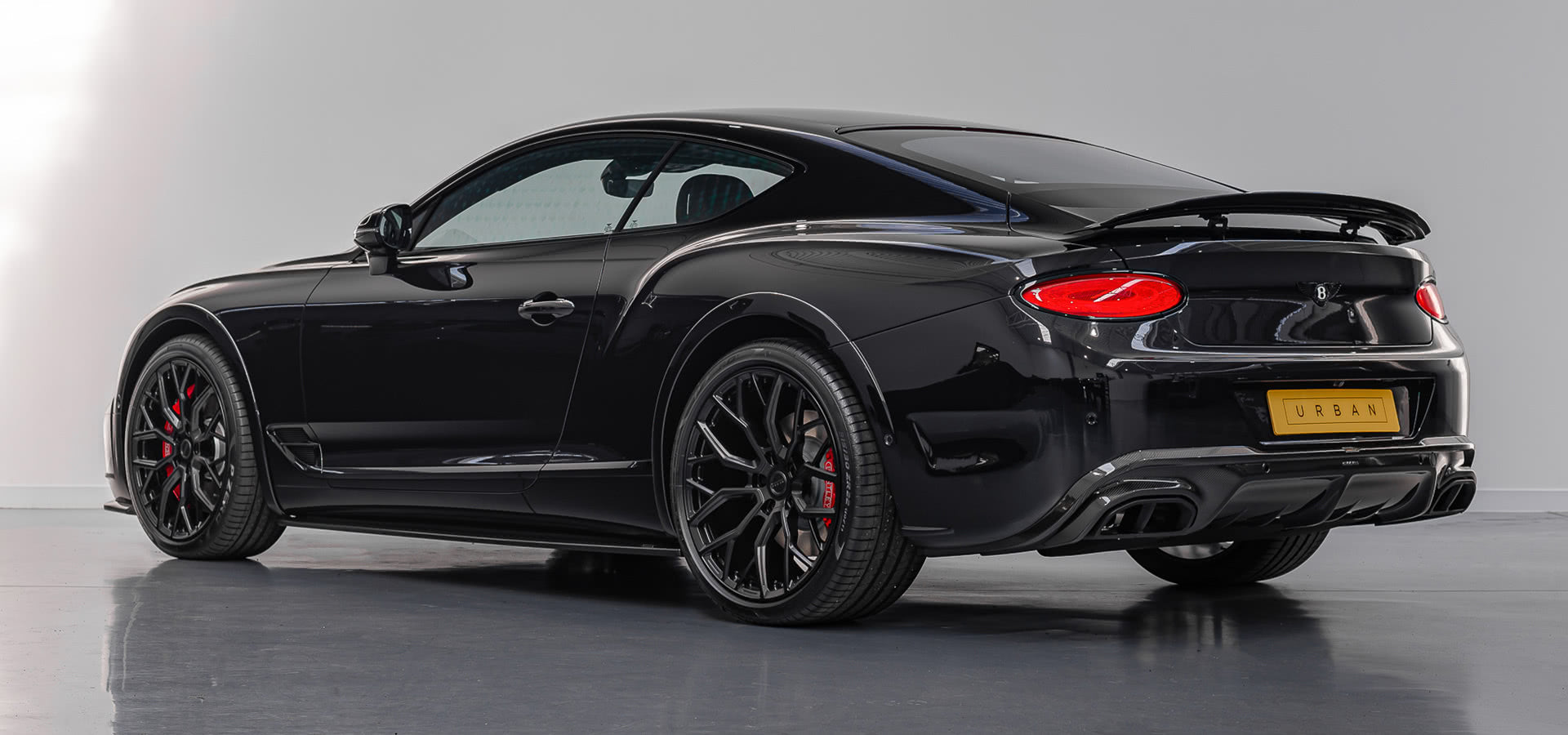 Rear three-quarter view of the black Urban Widetrack Continental GT
