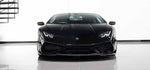 Front view of a black Lamborghini Huracan with the Urban carbon front splitter