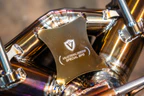McLaren 750S Valvetronic exhaust: Valvetronic shield plate on the titanium center section, close-up