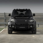 A front wide view of Urban Automotive XRS Limited Edition Carbon Quad-Pod Lazer Lightbar for Land Rover L663 Land Rover Defender 90 / 110 / 130 2020-2025 fitted on a car on the ground 