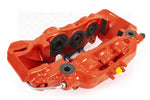 A top view of a red caliper of the AP Racing by Essex Road Brake Kit (Front 9561/380mm)- C7 Corvette with a white background