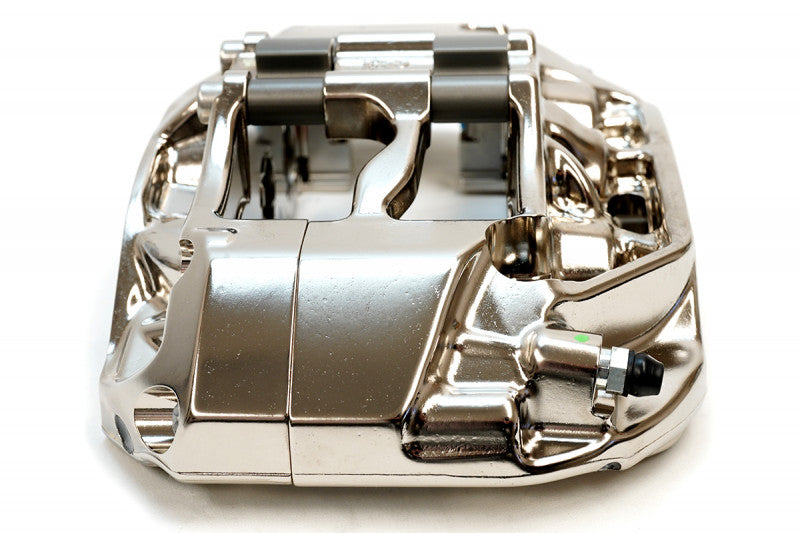 A close up top view of CP9660 of the AP Racing by Essex Radi-CAL ENP Competition Brake Kit (Front CP9660/355mm)- E36 M3 with a white background