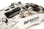A close up view of the CP9669 of the AP Racing by Essex Radi-CAL ENP Competition Brake Kit (Front CP9669/394mm)- McLaren Centerlock Wheels (620R/Senna) with a white background
