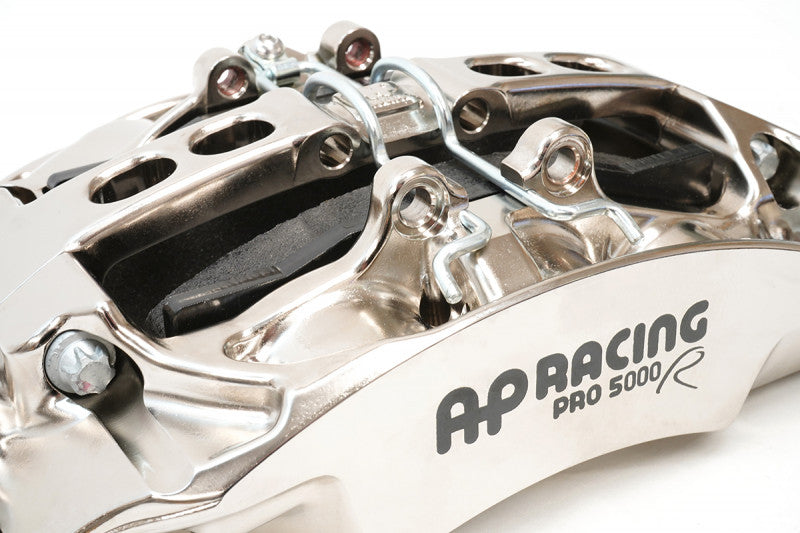 A close up view of the CP9669 of the AP Racing by Essex Radi-CAL ENP Competition Brake Kit (Front CP9669/394mm)- McLaren 720S, 650S, 600LT, MP4-12C with a white background