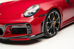 A front close up view of TECHART Front Air Outlet Grilles Porsche 992 Carrera / Targa / Turbo fitted on a red Porsche 