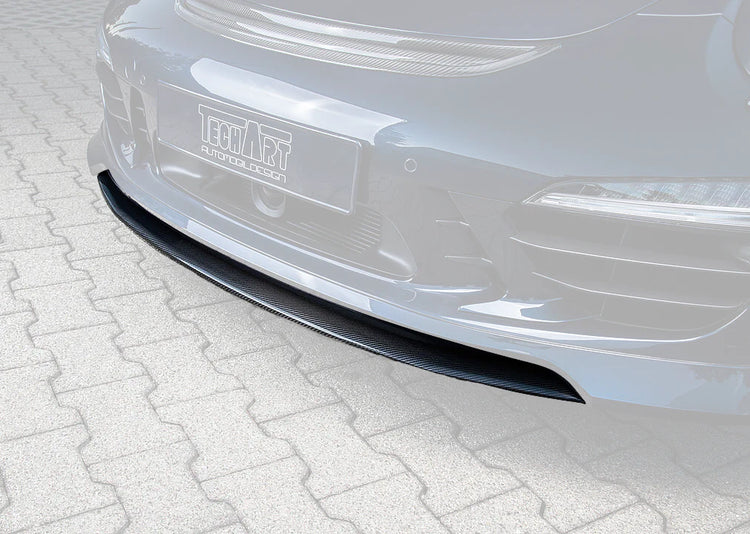 A close up view of TECHART Splitter Carbon, "glossy" for Porsche 981 / 991 / 970 Panamera as of MY14 fitted on a blue car with the spoiler highlighted