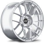 Silver alloy wheel with multi-spoke design and black center cap on clean white background - APEX Wheels wheel for 19x9.5 ET28 5x120 - Brushed Clear