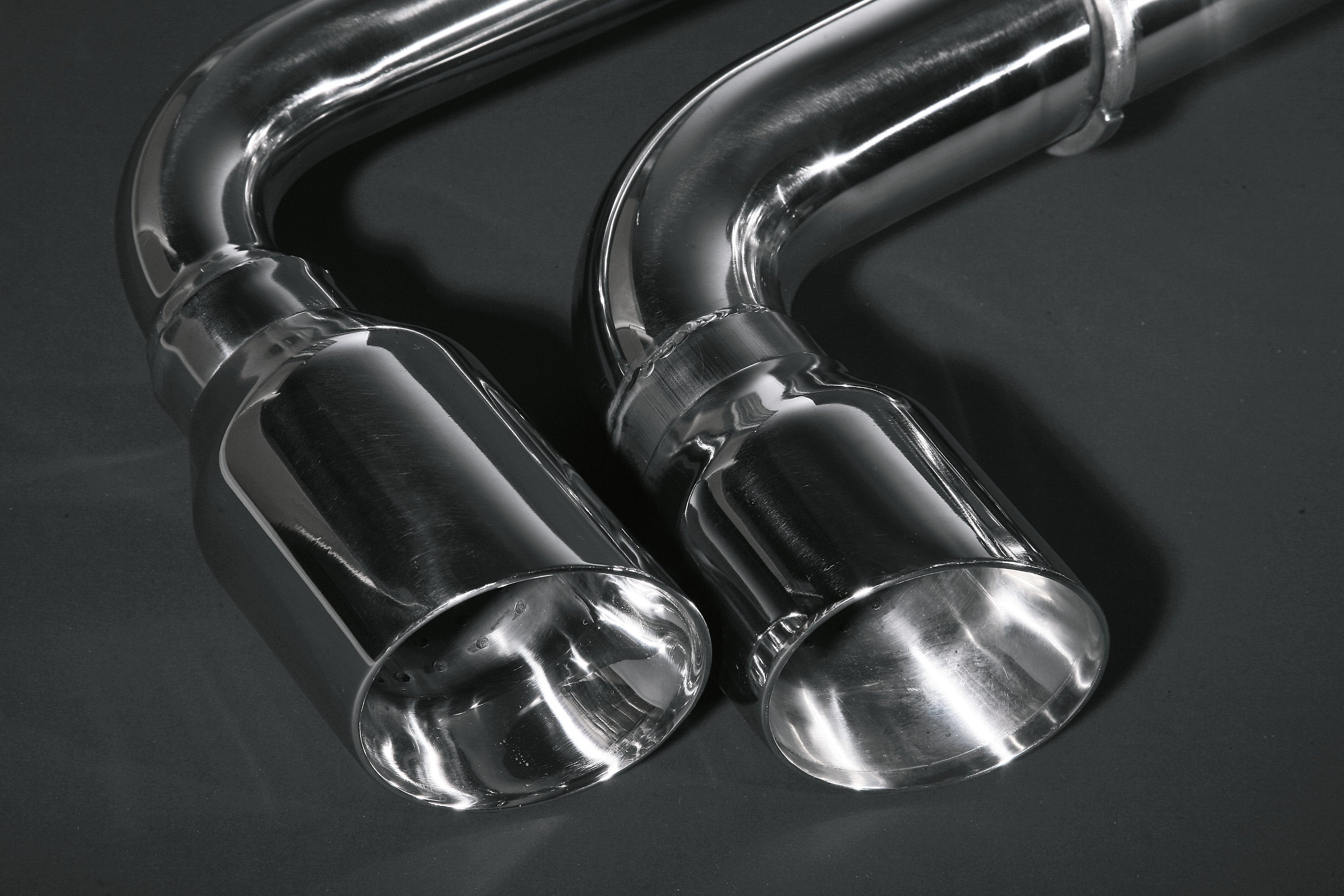 Close-up of Capristo polished round stainless tips on the Ferrari F430 valved exhaust