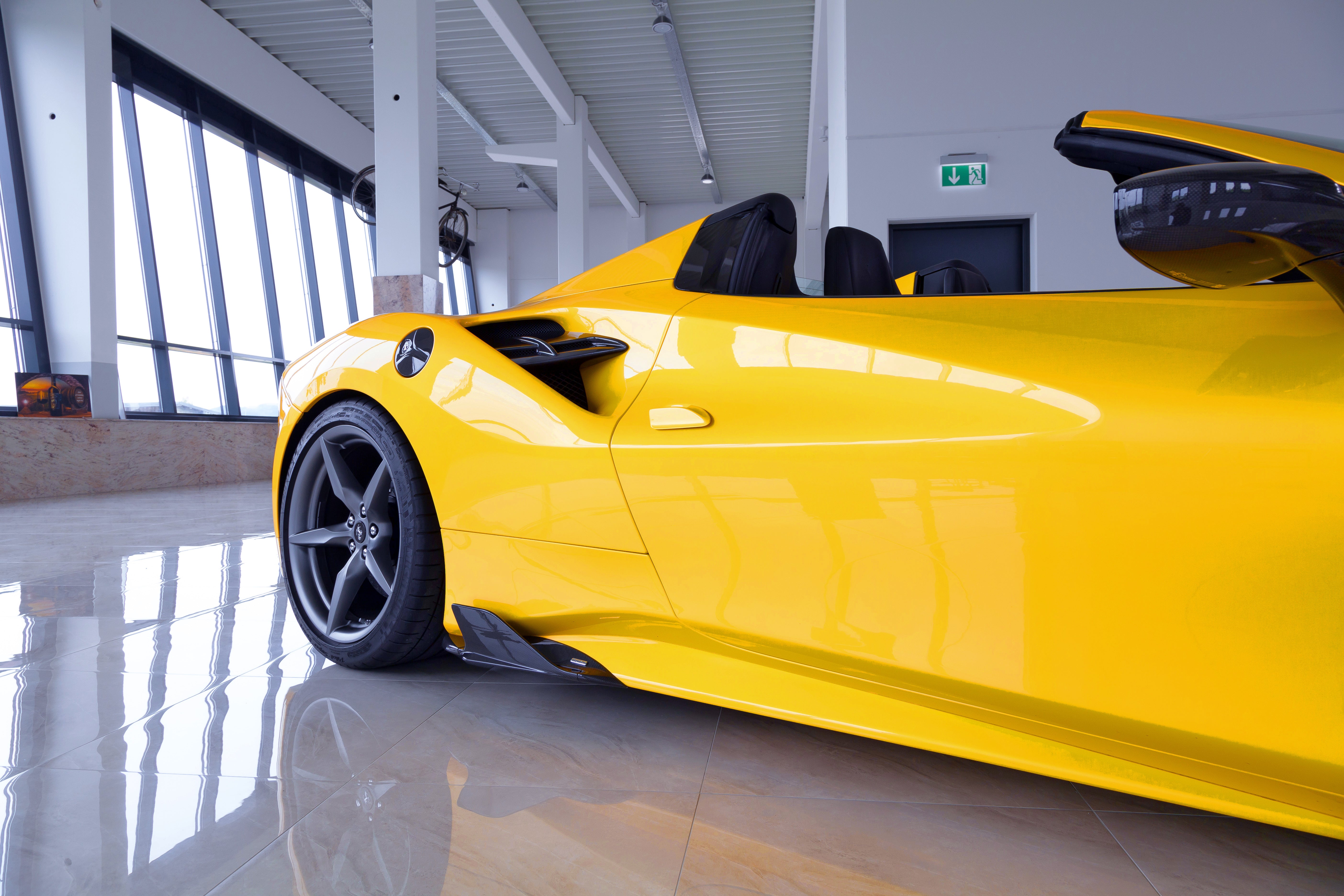Capristo carbon fiber side fin on a yellow Ferrari 488 Spider, side view