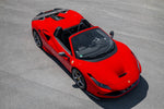 Red Ferrari F8 Spider from above with Capristo carbon front air vents