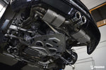 Underside view of the IPE exhaust installed on a Porsche 718 Cayman