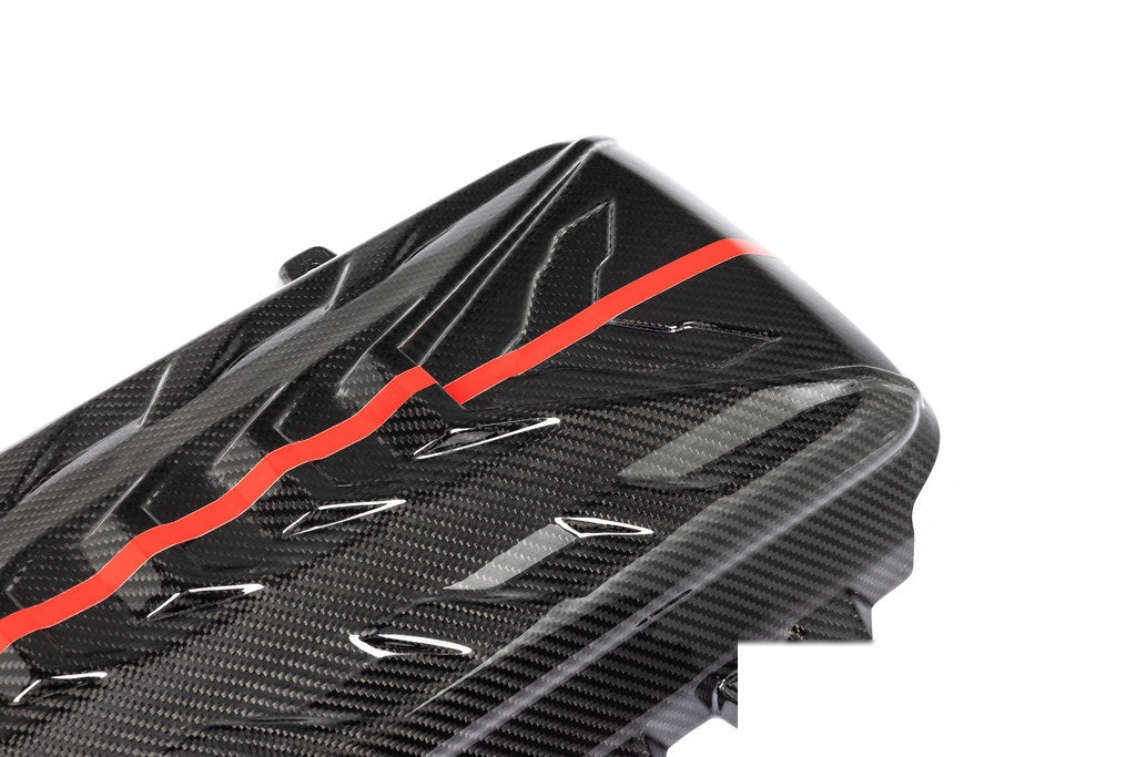 Black carbon fiber engine cover with red stripe accent and aerodynamic vents on white background - Eventuri engine cover for Chevrolet Corvette
