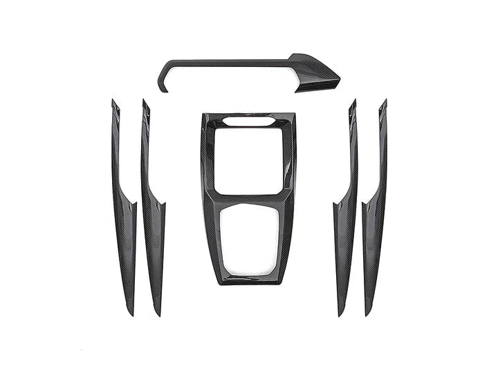 A front view of AUTOTECKNIC DRY CARBON FIBER INTERIOR TRIM - BMW G01 X3 | G02 X4 LCI 2022+ with white background