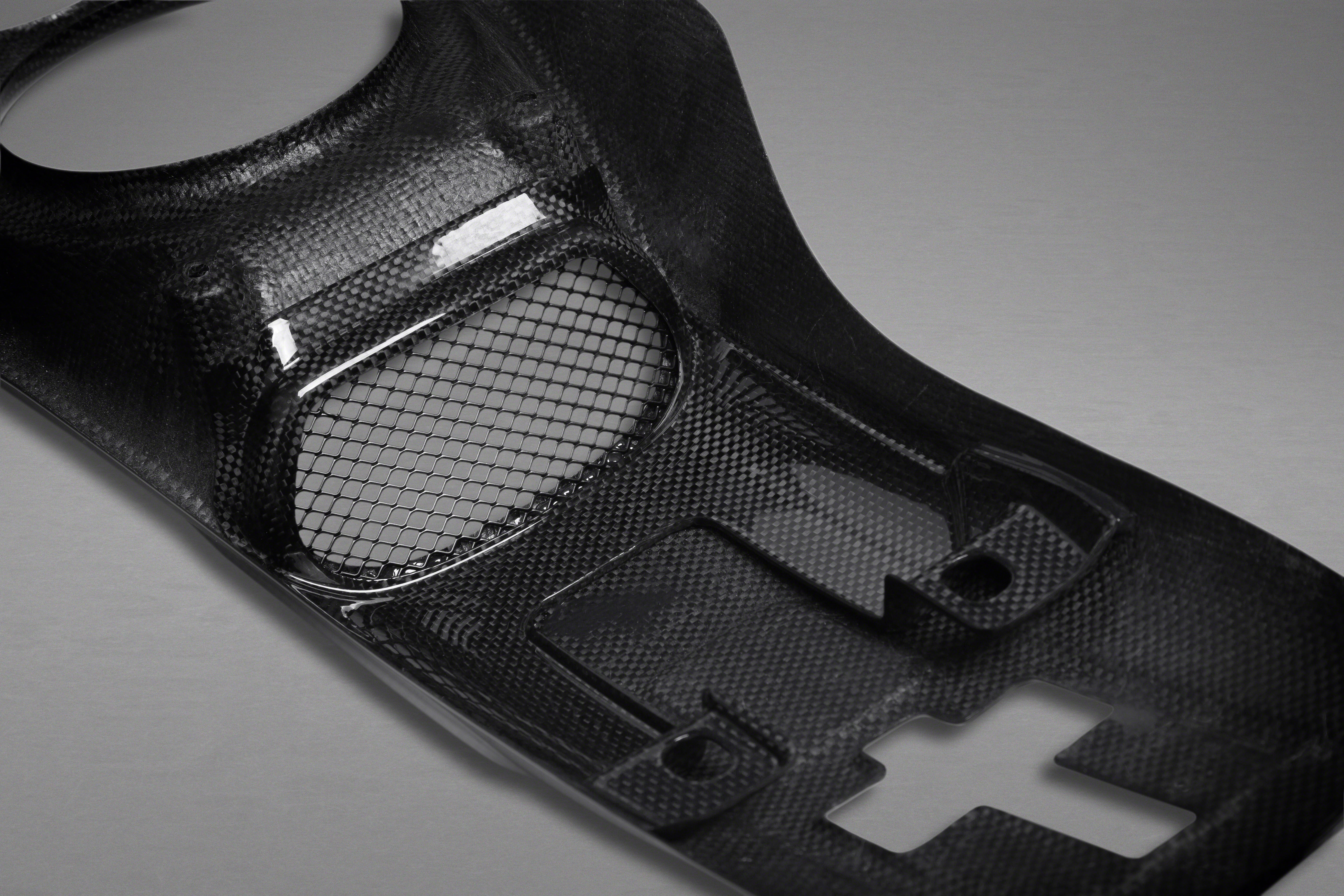 Close-up of carbon weave and mesh section on Capristo Ferrari 488 lock cover