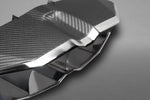 Close-up of carbon fiber weave and polished stainless edge on Capristo Aventador SV tip frame