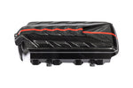 Carbon fiber engine cover with red accent stripe and angular vents on clean white background - Eventuri engine cover for Chevrolet Corvette