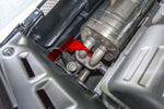 Capristo bracket kit highlighted in red on a Ferrari F430 factory muffler in the engine bay