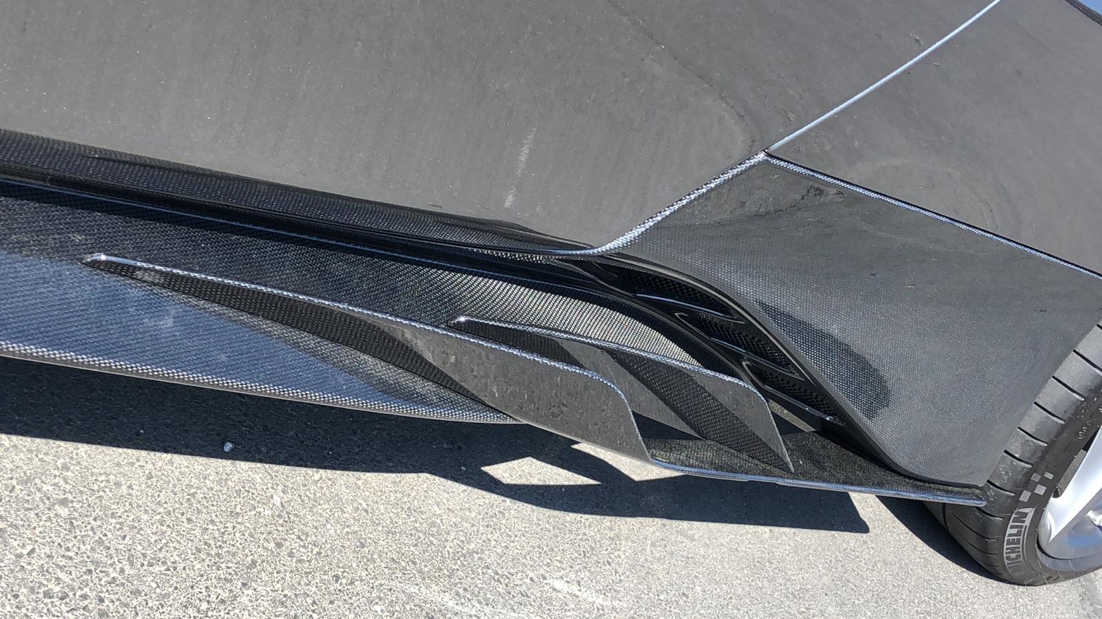 Capristo carbon side skirt with wings on grey Ferrari 488 Spider, close up