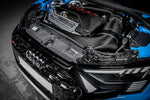 Carbon fiber intake system installed in engine bay with curved intake tubes and turbo engine visible - Eventuri intake for Audi RS3