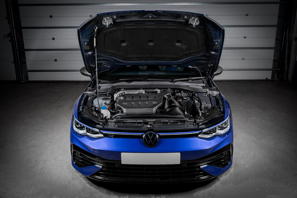 Black carbon fiber intake system installed in blue MK8 Golf R engine bay with hood open in garage - Eventuri intake for Volkswagen MK8 Golf R