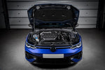 Black carbon fiber intake system installed in blue MK8 Golf R engine bay with hood open in garage - Eventuri intake for Volkswagen MK8 Golf R