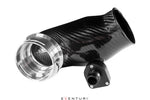 Black carbon fiber turbo inlet tube with polished aluminum flange and side branch connector on white background - Eventuri turbo inlet for BMW F90 M5 F91 F92 F93 M8