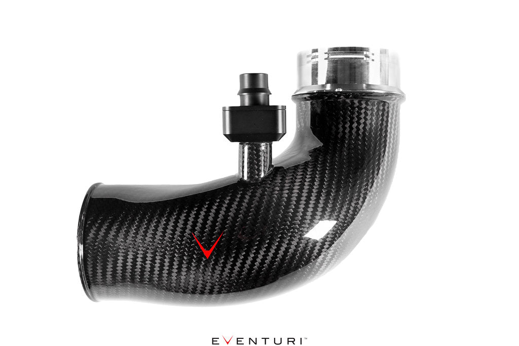 Curved carbon fiber inlet pipe with glossy finish, metal fittings, and red logo accent on clean background - Eventuri turbo inlet for BMW F90 M5 F91 F92 F93 M8