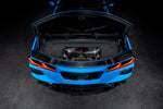 Carbon fiber intake system installed in rear engine bay of blue Corvette with trunk open - Eventuri intake for Chevrolet Corvette