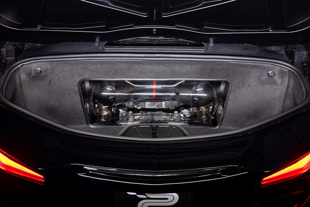 Carbon fiber air intake system installed in Corvette engine bay viewed through rear window opening - Eventuri air intake for Chevrolet Corvette