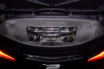 Carbon fiber air intake system installed in Corvette engine bay viewed through rear window opening - Eventuri air intake for Chevrolet Corvette