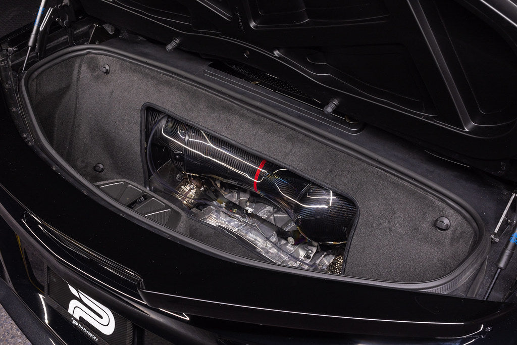 Carbon fiber air intake assembly installed in Corvette engine bay with curved tubes and intake box visible - Eventuri air intake for Chevrolet Corvette
