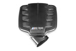 Black carbon fiber inlet plenum with horizontal air vents and central M V8 badge on white background - Eventuri inlet plenum for BMW M3