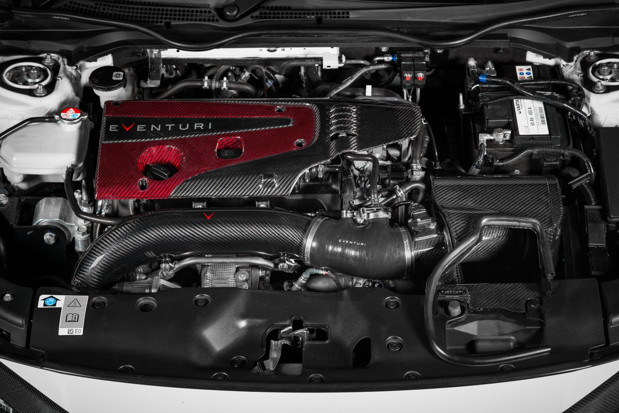 Black aluminum charge pipe with machined finish installed in Honda Civic Type R engine bay with carbon fiber intake system - Eventuri charge pipe for Honda Civic Type R