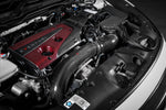 Black carbon fiber charge pipe installed in engine bay with intercooler piping and turbo connections visible - Eventuri charge pipe for Honda Civic Type R