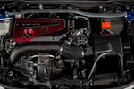Black charge pipe with curved design installed in engine bay alongside carbon fiber intake components - Eventuri charge pipe for Honda FL5 Civic Type R
